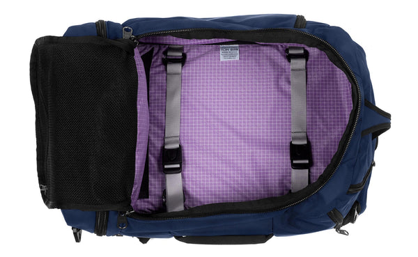 An open Techonaut 30 with a Deep Blue exterior and a Wisteria (pale purple with white grid) interior.